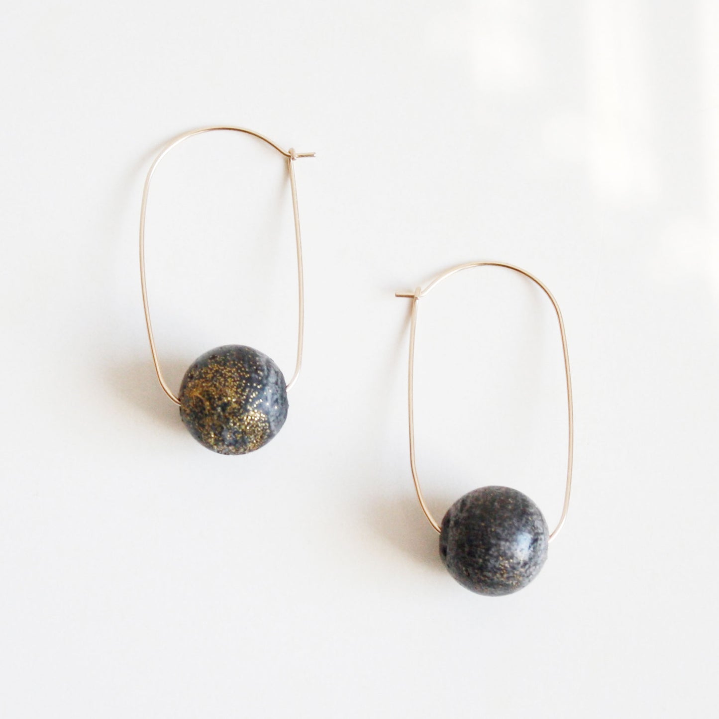 Oval Hoop Earrings with Large Black Balls