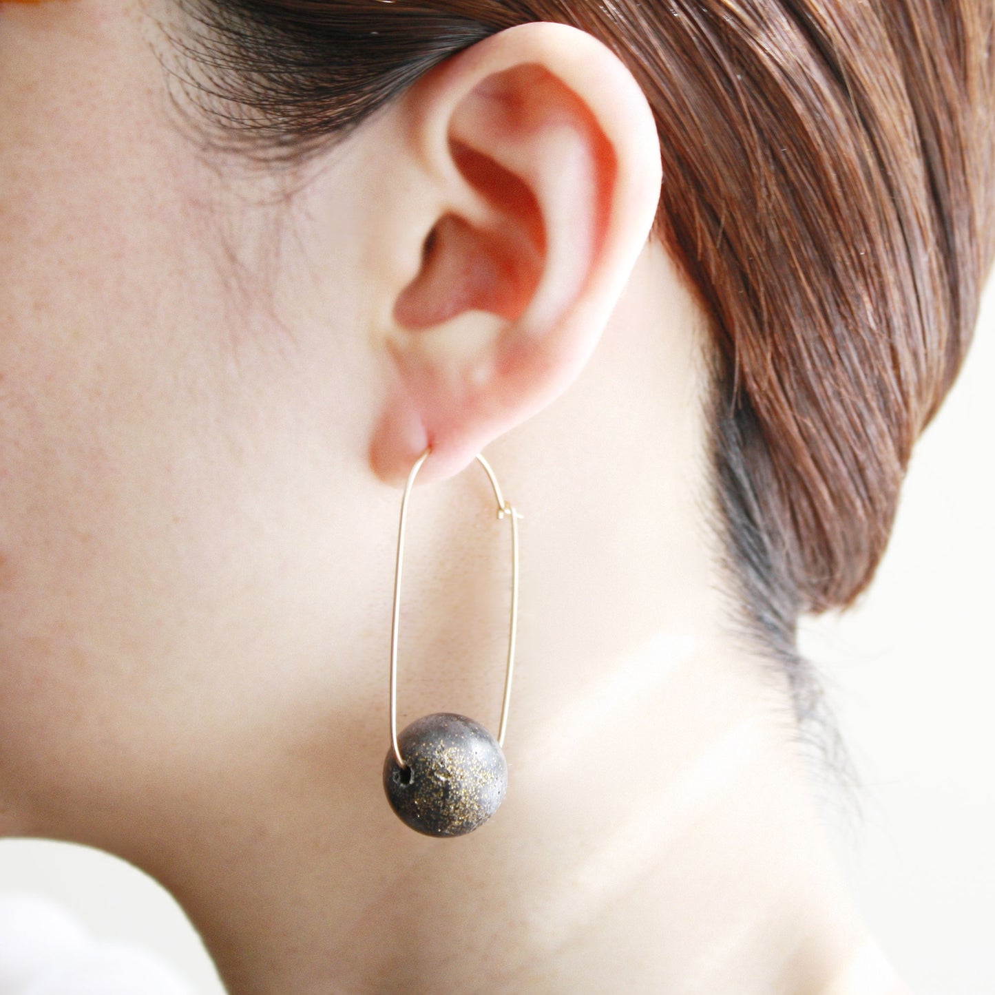 Oval Hoop Earrings with Large Black Balls