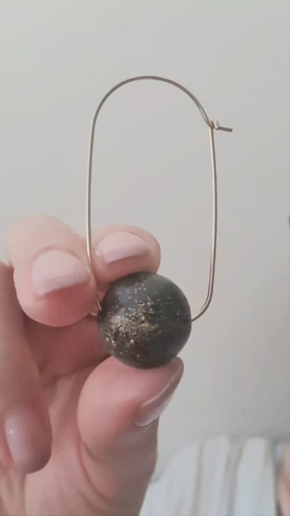 Oval Hoop Earrings with Large Black Balls