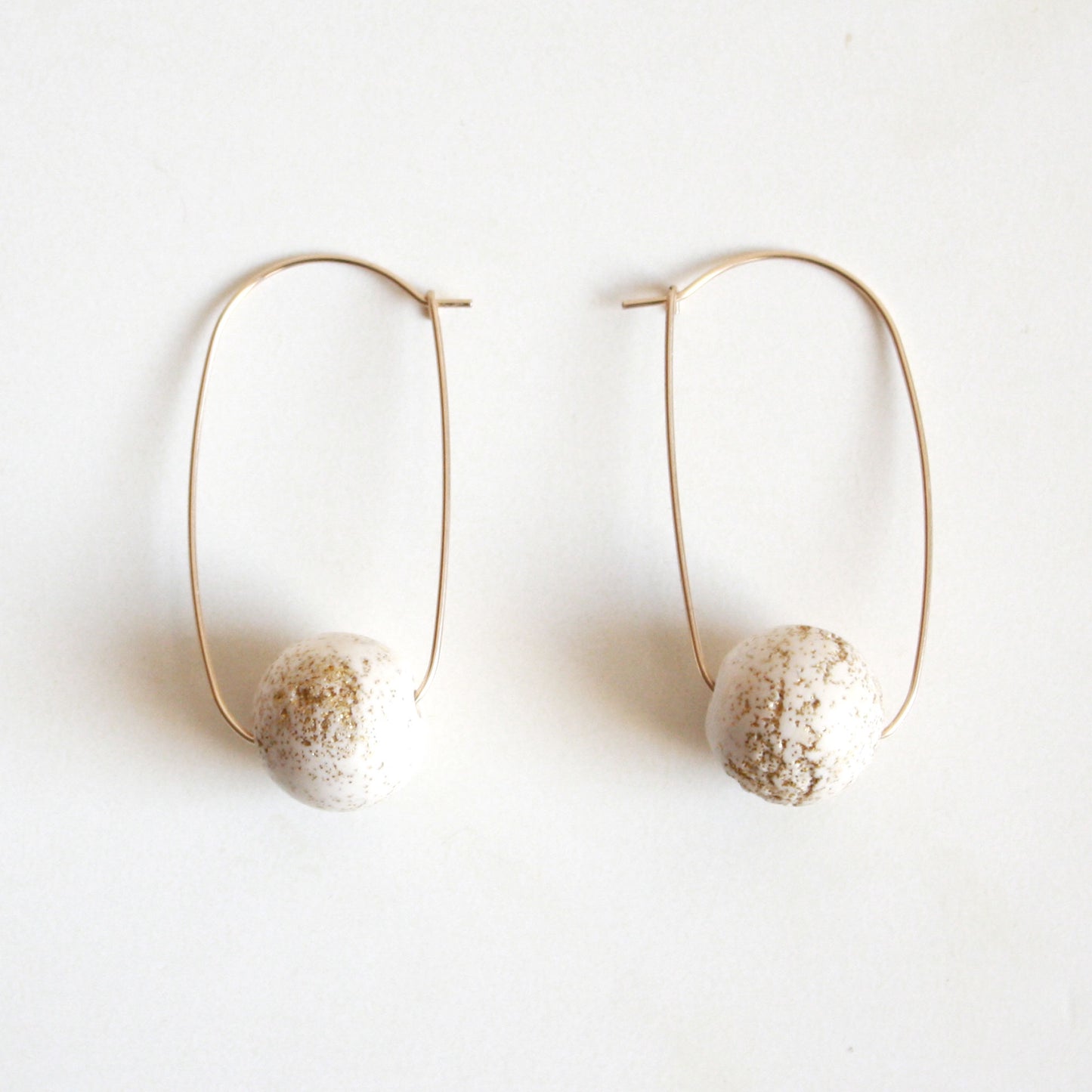 Oval Hoop Earrings with Large White Balls