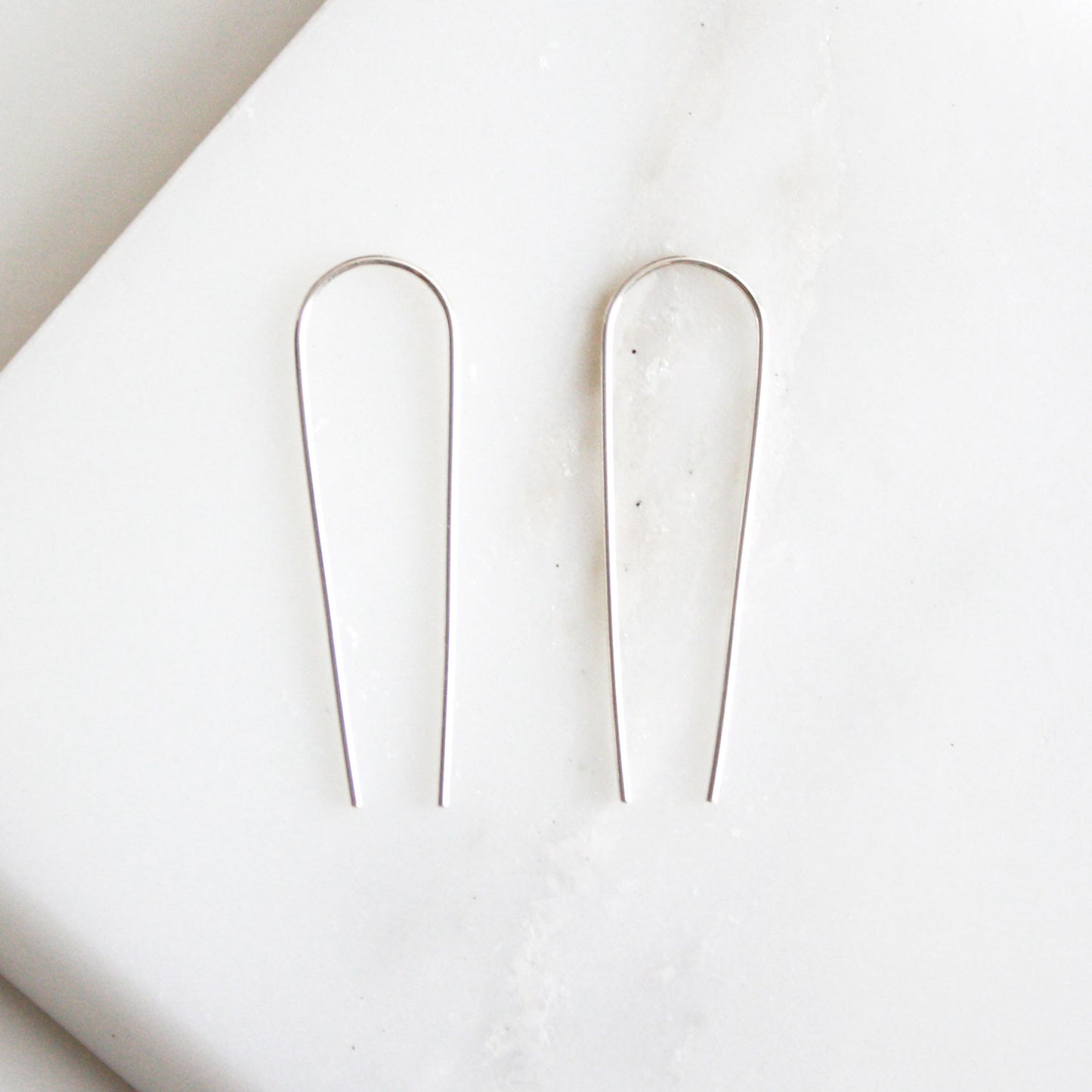 silver long arc earrings